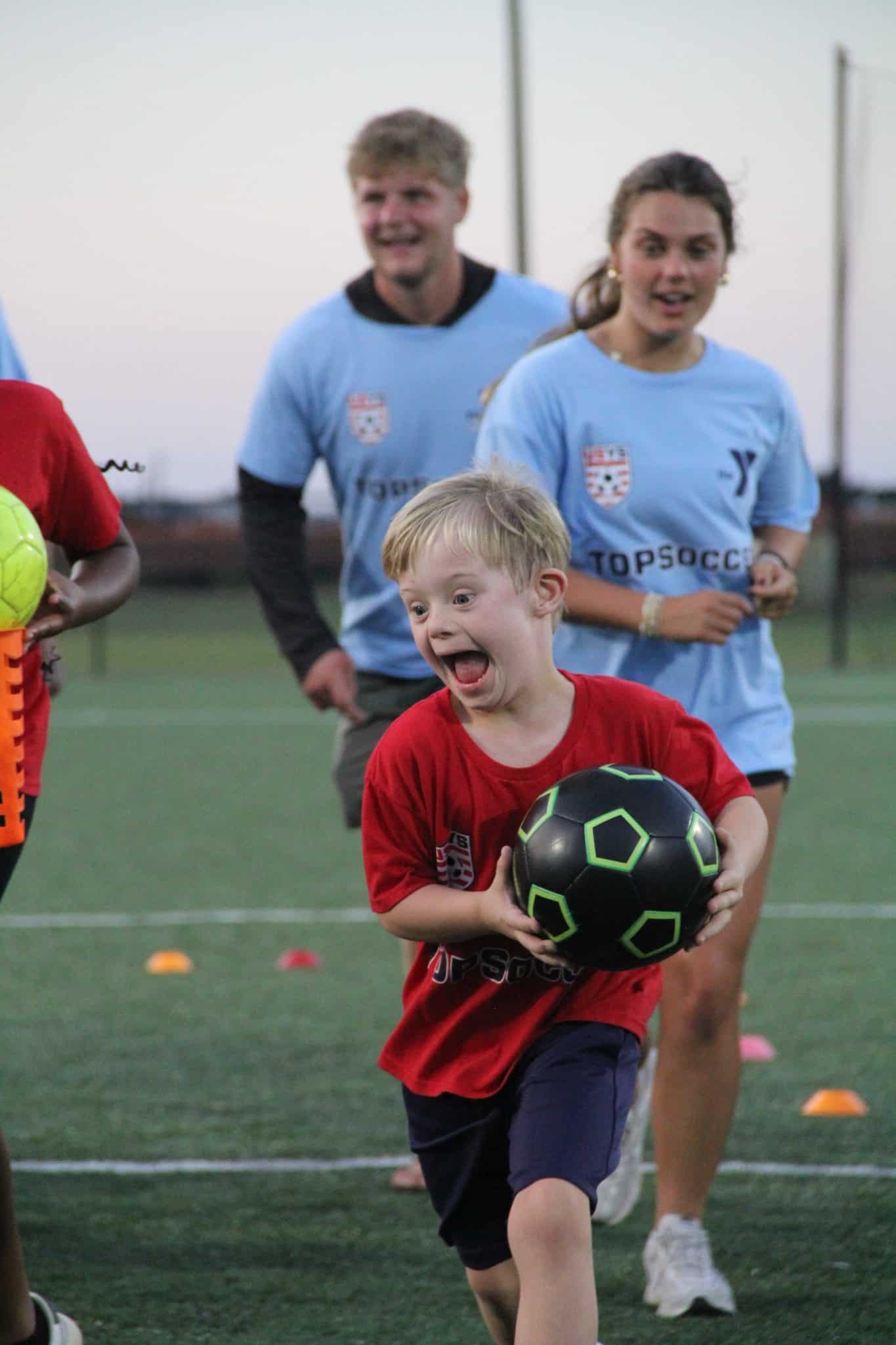 boy playing soccer
